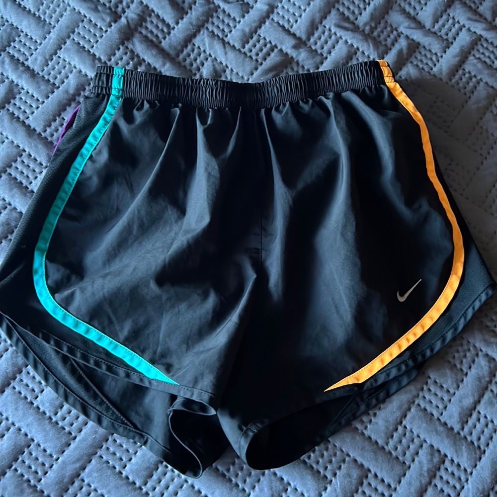 Black Nike athletic shorts, size small.